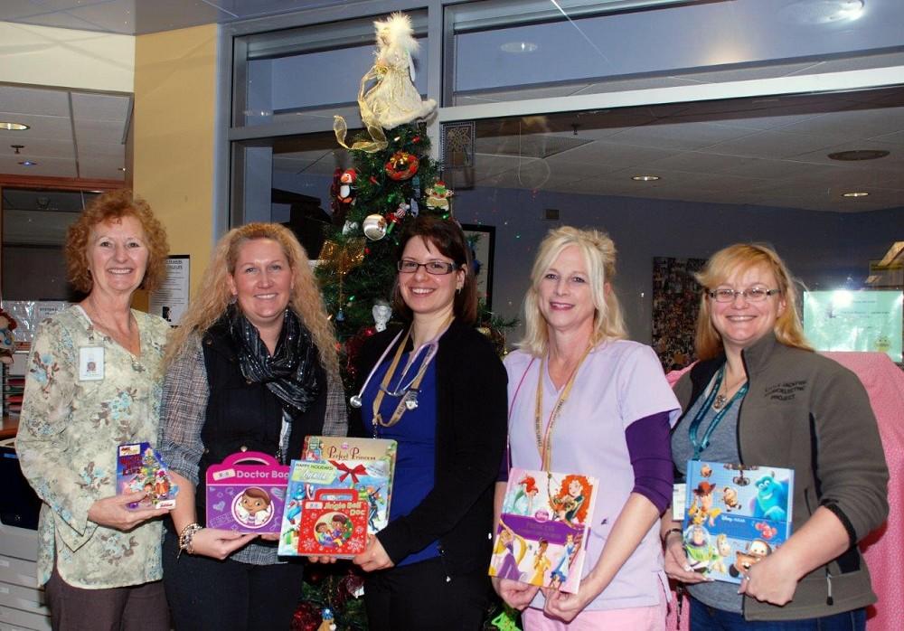Showing the wonderful selection of books donated to the Paediatrics Department at TBHRSC from Frontier College (Thunder Bay)