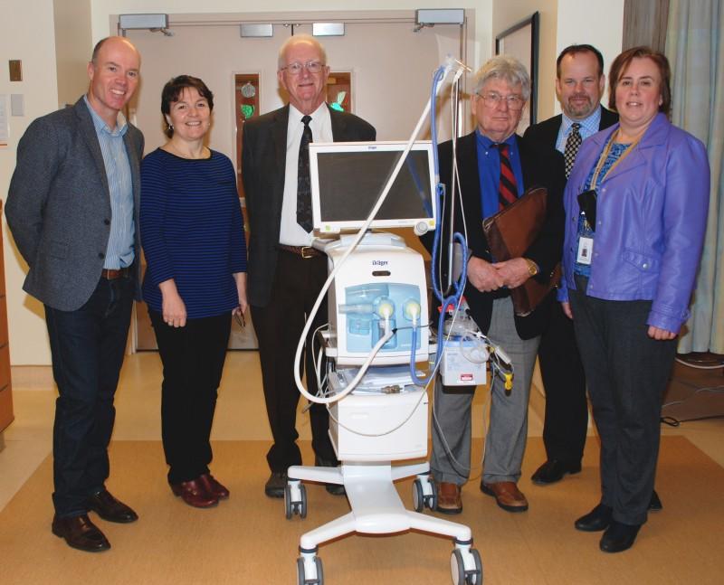 Pictured here with a neonatal ventilator, that provides safe, gentle ventilation for infants who need extra assistance are board memebers and employees from the John Andrews Foundation, TBRHSC & TBRHSF.