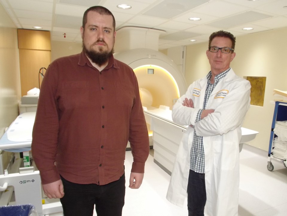 Dr. Mitchell Albert has been working on a medical imaging technique that uses xenon in MRIs. Here, Albert (R) is shown in front of an MRI scanner with Dr. Yurii Shepelytskyi (L).