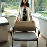 Allyson Adduono, Nurse Practitioner with one of six brand new bariatric chairs purchased through the Family CARE Grant Program.