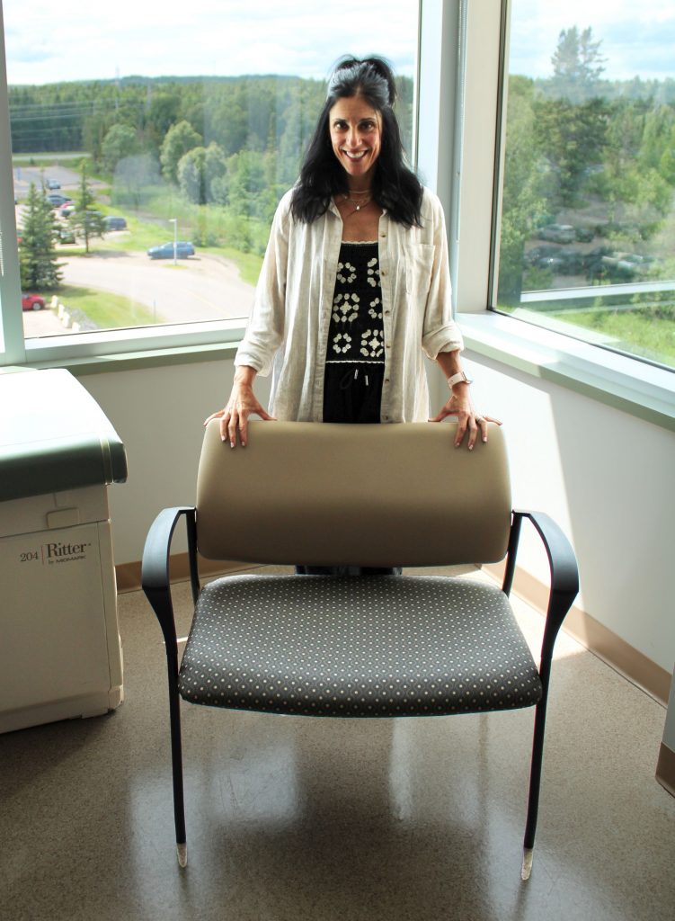 Allyson Adduono, Nurse Practitioner with one of six brand new bariatric chairs purchased through the Family CARE Grant Program.