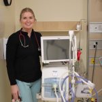 Taylor Dewal, Registered Respiratory Therapist with the new two-in-one ventilator.