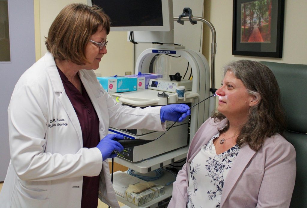 Pictured (L-R) Dr. Margaret Anthes performing a mock demonstration of the rhinolaryngoscope on Mellissa Linke, Manager of Radiation Therapy, Surgical Oncology & Tamarack House.