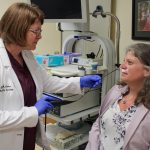 Pictured (L-R) Dr. Margaret Anthes performing a mock demonstration of the rhinolaryngoscope on Mellissa Linke, Manager of Radiation Therapy, Surgical Oncology & Tamarack House.